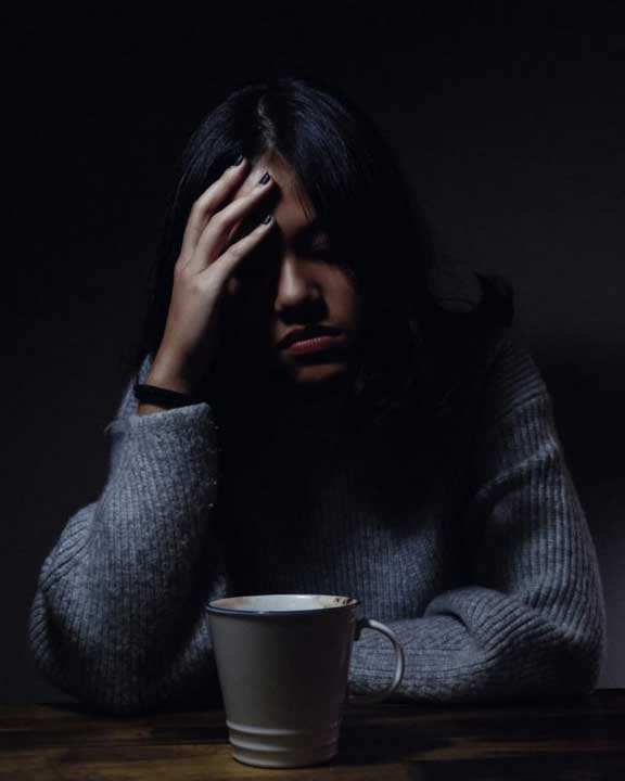 woman experiencing a headache